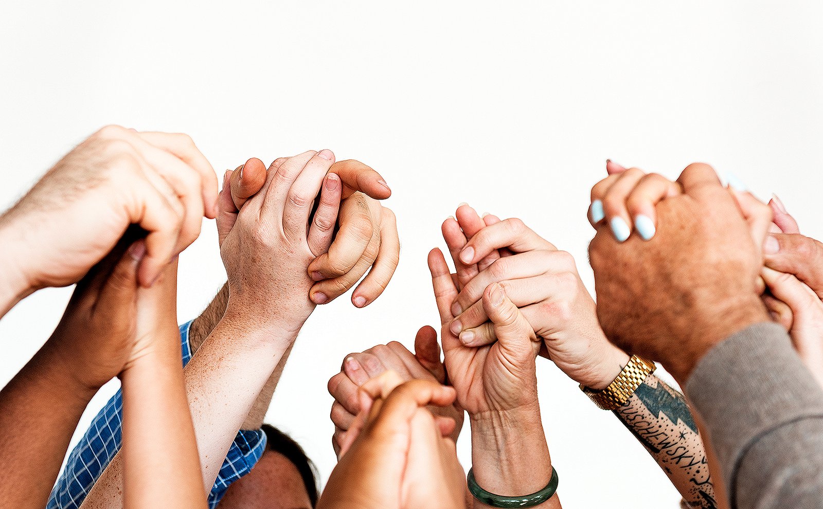 Closeup of diverse people holding hands